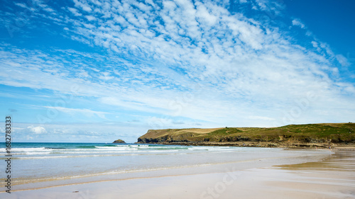 A panoramic view of Polzeath Beach, Cornwall, on a sunny summer's day