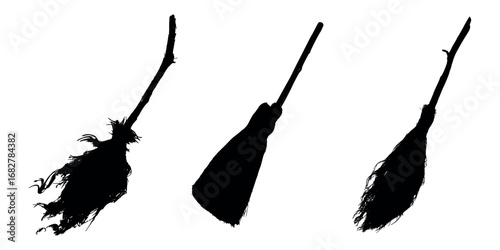 Set of black silhouettes of witches' brooms. Witch's flying broom on isolated background. Magical elements of the witches' coven for Halloween. Happy Halloween and witches' holiday. 