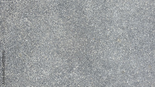 Fototapeta Naklejka Na Ścianę i Meble -  Gray gravel concrete floor, road surface, walkway surface, small gravel road surface, texture, and background.