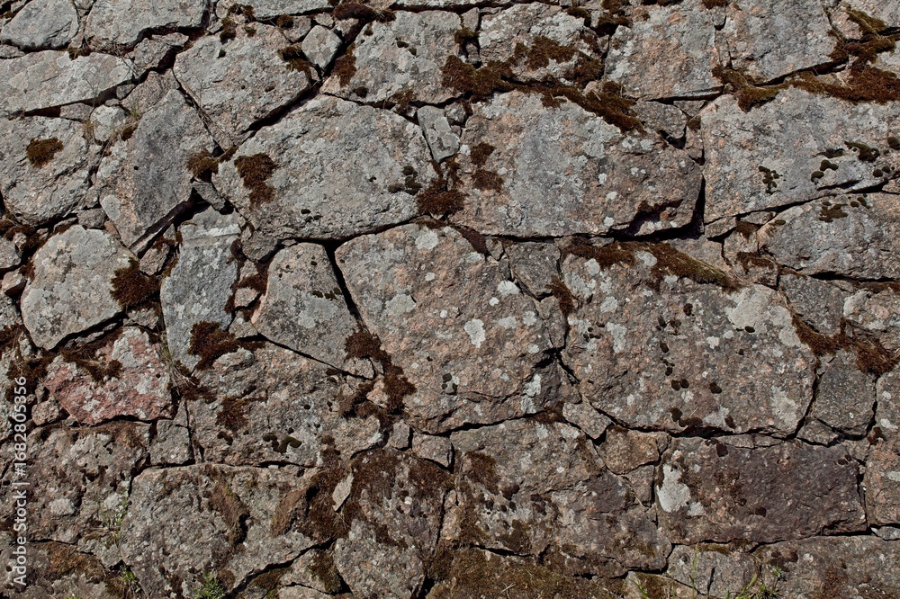Fototapeta premium Closeup of old stone wall background texture.