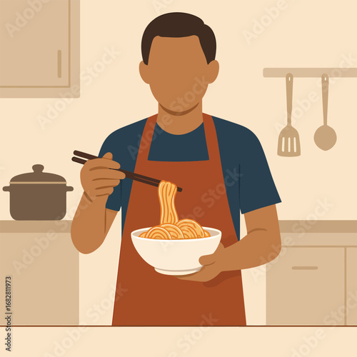 Man in apron eating noodles with chopsticks in kitchen.