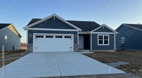 New Home Exterior with Blue Siding and Concrete Driveway