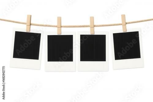Four blank instant photos are hanging on a clothesline with wooden clothespins against a transparent background