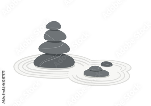 Stacked stones sit in a raked sand garden