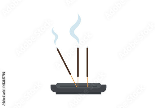 Three incense sticks are placed in a dark oblongshaped holder with smoke rising from the tips