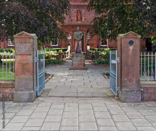 The Arbroath Library situated on Hill Terrace, an old Building built of Red Sandstone, with an impressive statue of Robert Burns at the Entrance.
