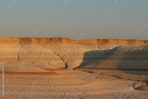 The colorful iron limestone formations of Kyzylkup at sunset, Kazakhstan