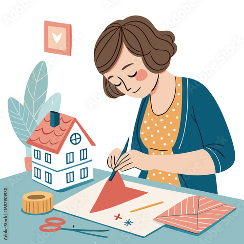 A woman engaged in a creative paper crafting hobby at her desk.