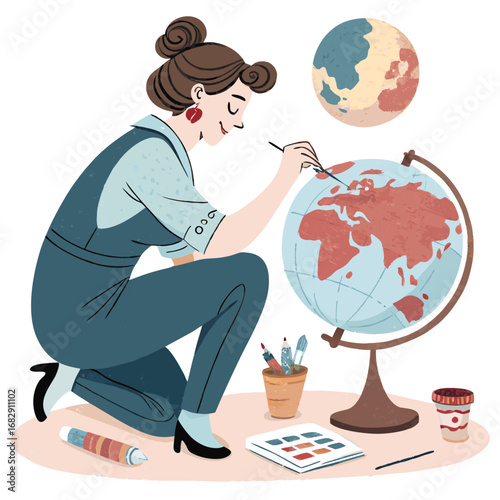 Artist carefully painting the continents on a world globe.