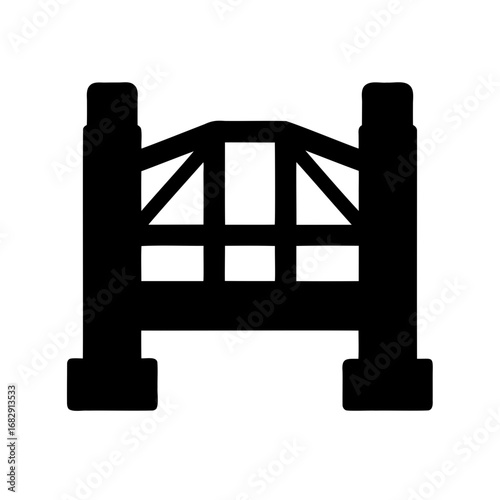 Silhouette of a rustic wooden gate with reinforced framing and sturdy posts