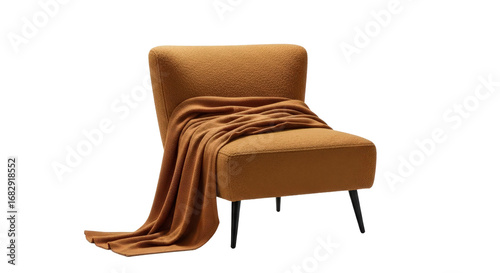 Stylish chair features a blanket draped over its seat. Interior design, furniture, comfortable seating, home decor.