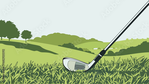 Golf club resting in lush green grass on a rolling hillside