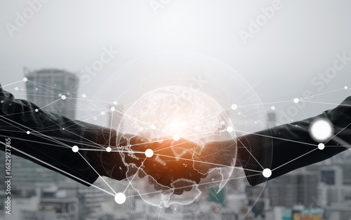 Photos Business people shaking hands and global network concept
