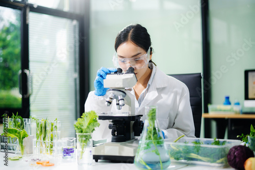 Scientist testing food samples in lab with microscope, vegetables, and meat for safety, nutrition, and biotechnology
