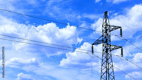 Steel lattice transmission tower with high-voltage power lines set against a vibrant blue sky with fluffy white clouds
