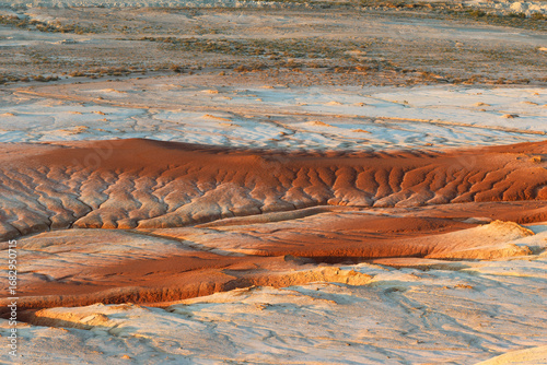 The colorful iron limestone formations of Kyzylkup at sunset, Kazakhstan