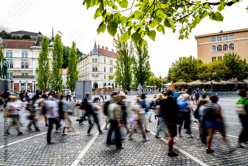 In Ljubljana’s lively center, countless visitors cross the square, highlighting the charm of the city and also the undeniable reality of mass tourism shaping the urban experience.