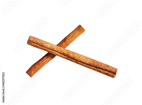 Two crossed cinnamon sticks against black background