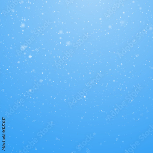 Realistic falling snow on blue background. Snowflakes overlay for Christmas. Abstract winter PNG