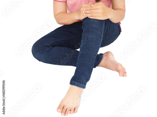 Woman suffering from knee pain sitting floor at home, bone and joint diseases. Medical concept.