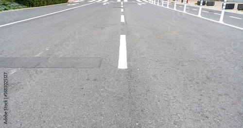 Wallpaper Mural Freshly painted road with white dashed lane markings on smooth asphalt Torontodigital.ca