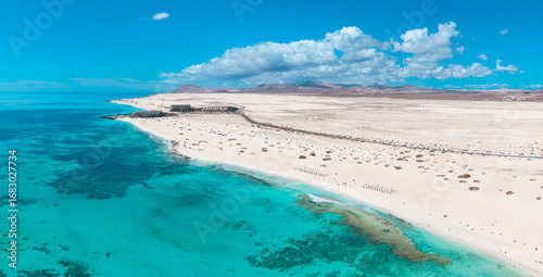 High quality aerial panoramic image of the beautiful Flag Beach, Grandes Playas with Lobos island in the background near Corralejo in Fuerteventura Spain