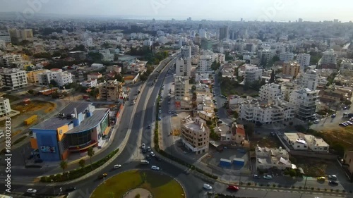 Aerial view of Larnaca, Cyprus. 
Morning traffic in the urban environment. Buildings, roads, cars and historical views.