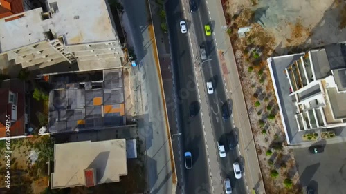 Aerial view of Larnaca, Cyprus. 
Morning traffic in the urban environment. Buildings, roads, cars and historical views.