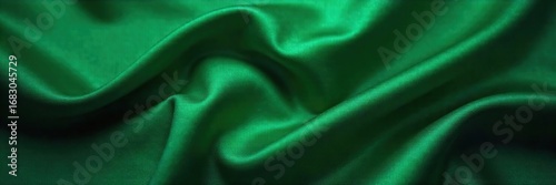 Luxurious, shimmering silk fabric in a rich, deep emerald green Draped elegantly to showcase its texture and subtle sheen Perfect for fashion, design, and textile projects , vibrant, shiny
