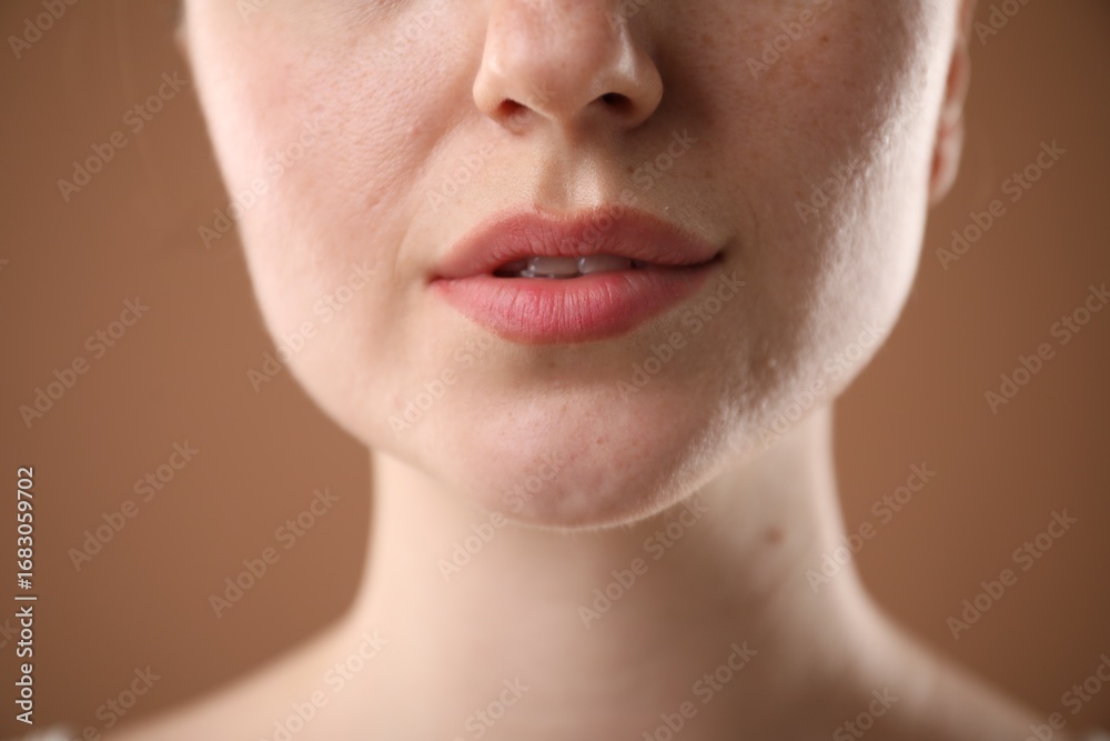 Fototapeta premium Woman before cosmetic procedure on brown background, closeup