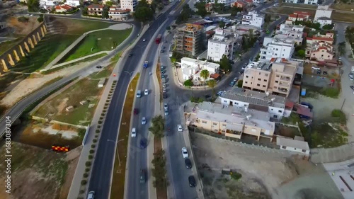 Aerial view of Larnaca, Cyprus. 
Morning traffic in the urban environment. Buildings, roads, cars and historical views.