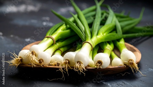 Fresh green onions on a wooden tray