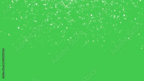 Falling gold sparkles over green screen chroma key. Seamless loop.