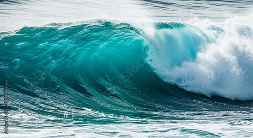 Fototapeta Naklejka Na Ścianę i Meble -  Teal ocean wave crashing, white foam cresting, powerful dynamic movement, symbolizes nature's energy, power, and beauty, ideal for travel or nature themes