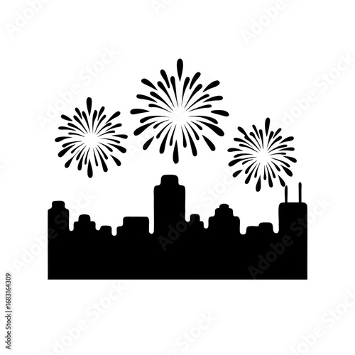 Silhouette of a city skyline with fireworks exploding in the sky
