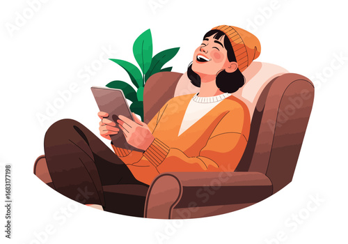 A young woman relaxing on a comfortable sofa while using a tablet, appears to be thoroughly enjoying herself