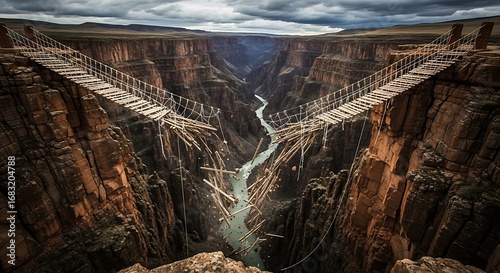 Suspension bridge across a canyon symbolizes broken connections and challenge
