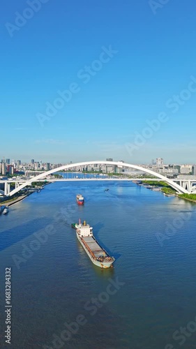 4K Real Time Aerial view of Lupu bridge and Huangpu River in Shanghai on sunny day.