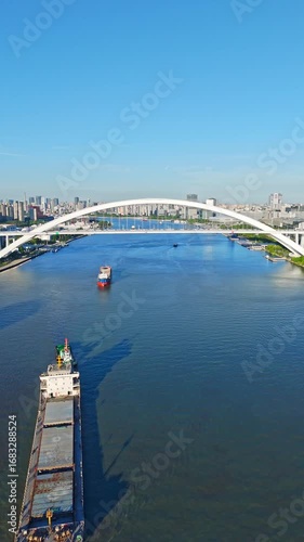 4K Real Time Aerial view of Lupu bridge and Huangpu River in Shanghai on sunny day.