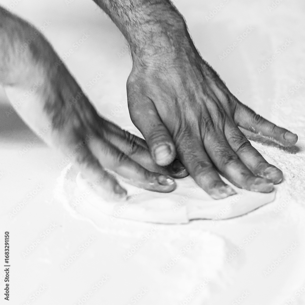 Fototapeta premium Making pizza dough on board with flour