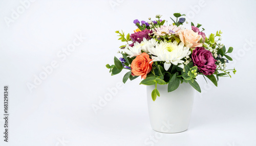 Wallpaper Mural a vibrant floral arrangement in a simple white container. the arrangement includes a variety of flowers in shades of white, purple, peach, and orange, complemented by green foliage Torontodigital.ca