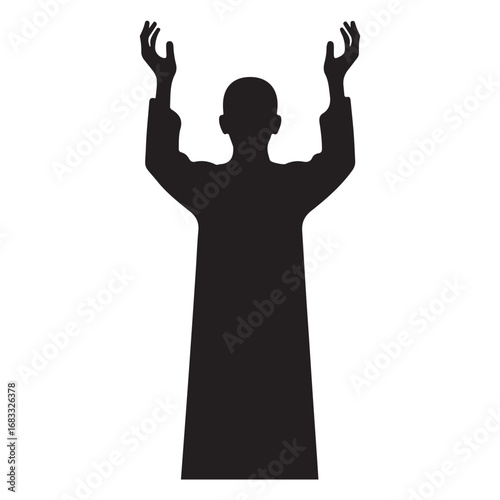 Person praying with hands raised in silhouette