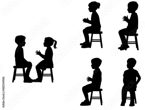 Silhouette of children sitting on stools playing clapping games together
