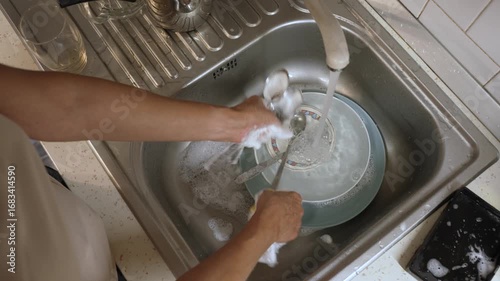 Woman washing dishes