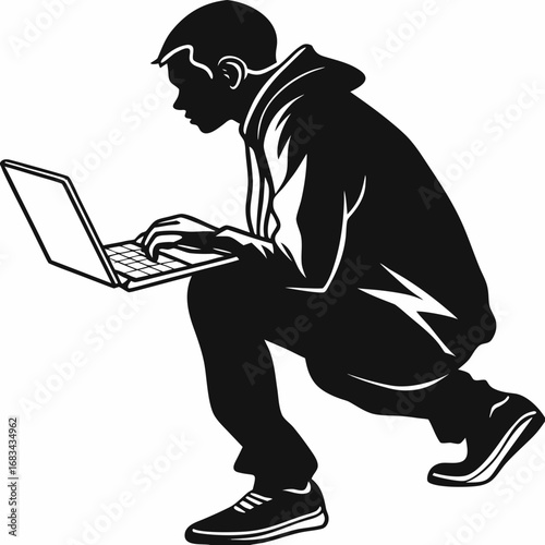 silhouette of a man working on laptop