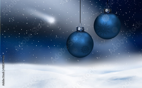 Zwei Blaue Weihnachtskugeln vor blauem winterhintergrund