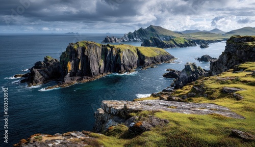 Dramatic coastal scenery with rugged cliffs, turquoise water, and dramatic clouds