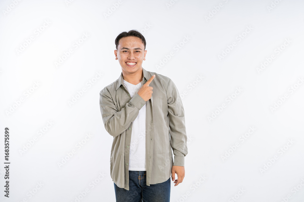 Fototapeta premium A cheerful young man gestures energetically, showcasing his positivity and enthusiasm