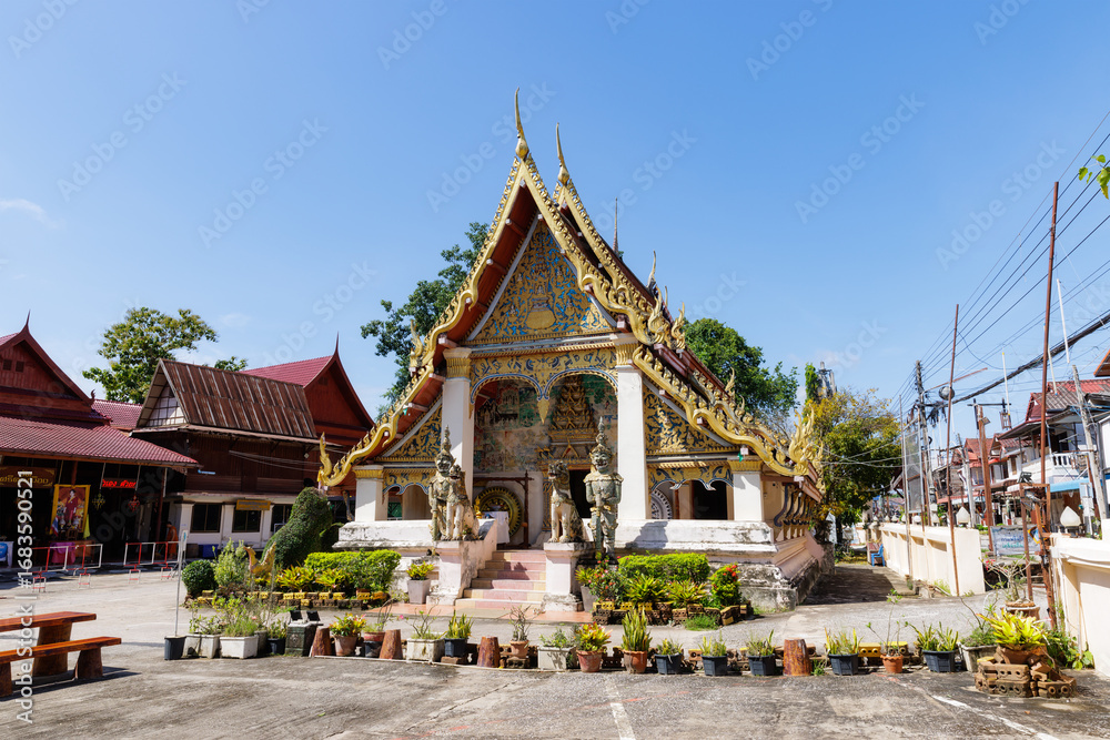 Fototapeta premium Loei, Thailand - 21 September 2023 : Wat Si Khun Mueang temple for thai people respect and praying with travelers people visit and travel at Chiang Khan in Loei province, Thailand