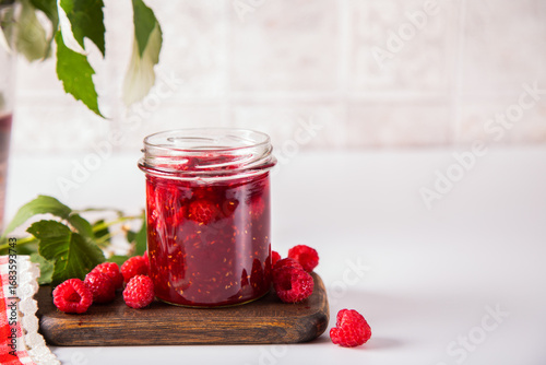Homemade raspberry jam with fresh berries